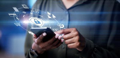 Person with personal smartphone with icon hologram for safety lock on network, information or data, privacy, antivirus or hacking and fraud or access control shield.
